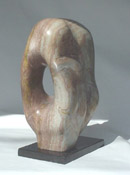 Kanryuu Sculpture by Carl Wright.  Translation: River Flows Through.  Green & Brown Alabaster on Black Granite Base.  Sculpture: 15"w x 9"d x 20"t.  Base: 8" x 13".  $3,000.   Represented by: The Robert Roman Gallery, Scottsdale, AZ. 800-423-3818.  www.RobertRomanGallery.com